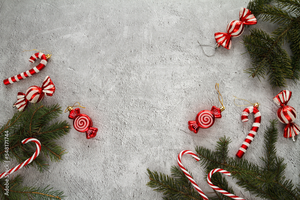 Φωτογραφία Red Christmas ornaments, candy canes, pendant decorations and tree branches