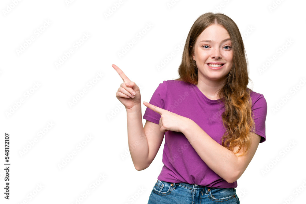 Young pretty woman over isolated background frightened and pointing to the side Young pretty woman over isolated background frightened and pointing to the side