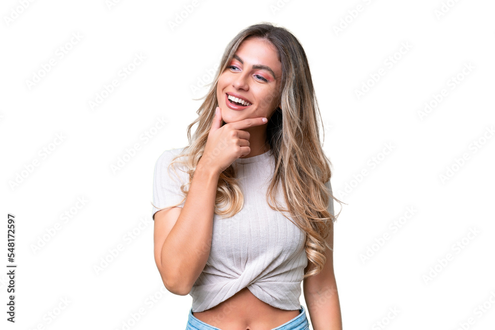 Young Uruguayan woman over isolated background looking to the side and smiling Young Uruguayan woman over isolated background looking to the side and smiling