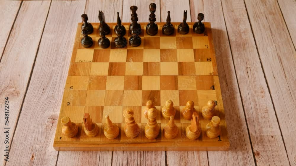 Stop motion of chess pieces on a wooden chessboard Stop motion of chess pieces on a wooden chessboard