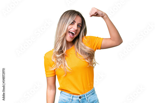 Young Uruguayan woman over isolated background doing strong gesture