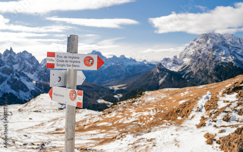 Mountain paths signs at the 3 Cime di Lavaredo. Red and white sign to direct hikers towards their destination. Summer time. Trail signs with the background of the Tre cime di Lavaredo. Dolomites Italy