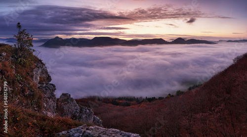 Dramatic autumn sunrise in mountain with red sky and clouds © TTstudio