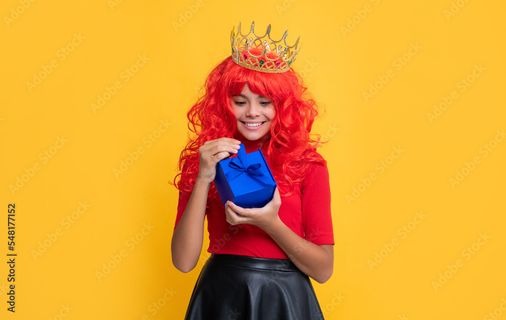 smiling queen crown in crown with present box on yellow background smiling queen crown in crown with present box on yellow background