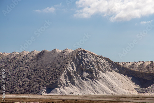 Принти на полотні Mountains of salt in a salt factory at sunset on a sunny day.