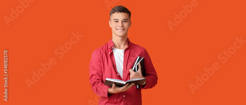 Teenage boy with books on o...