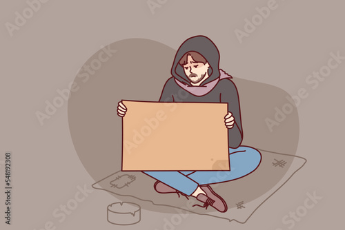 Poor man begging on street holding mockup board or paper. Unhappy male beggar suffer from poverty with placard in hands. Vector illustration. 