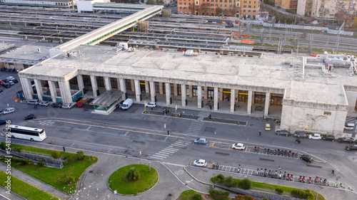 Aerial view of Roma Ostiense, a railway station in Rome, Italy. The entire facade is made of Travertine marble and the entrance is marked by a columned portico.