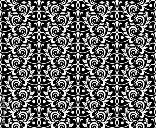 Wallpaper in the style of Baroque. Seamless vector background. White and black floral ornament. Graphic pattern for fabric, wallpaper, packaging. Ornate Damask flower ornament