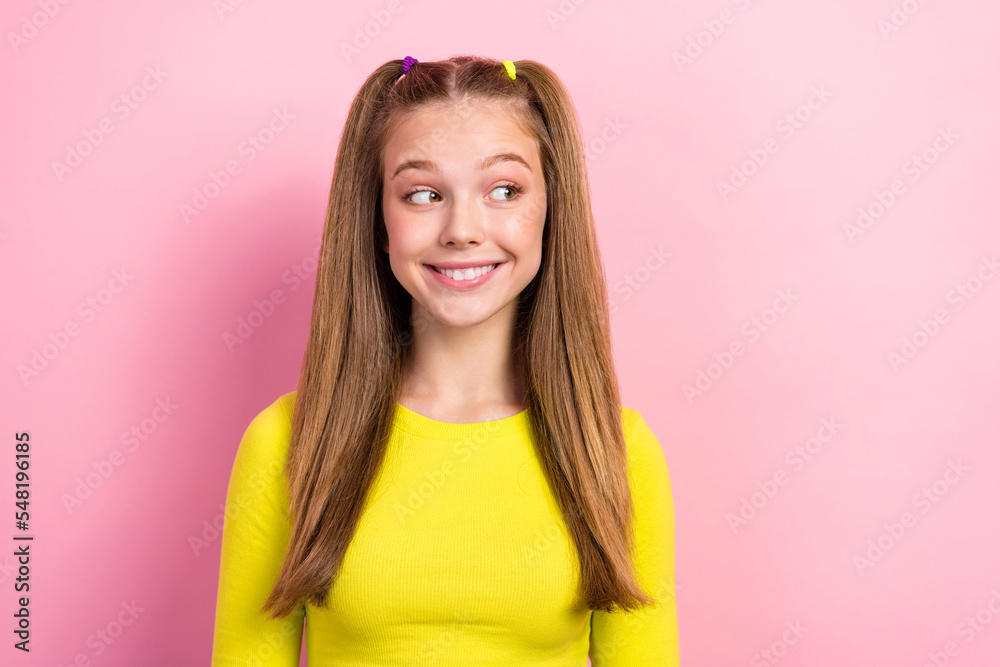 Portrait of interested good mood girl with straight hairdo wear yellow long sleeve look empty space isolated on yellow color background Portrait of interested good mood girl with straight hairdo wear yellow long sleeve look empty space isolated on yellow color background