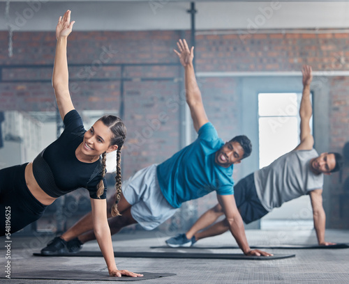Fitness, team and stretching arms for workout, exercise or training together with smile at the gym. Active people in a sports class for warm up stretch, arm and body balance in healthy wellness