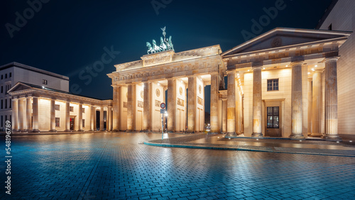 the brandenburg gate in berlin at night photo