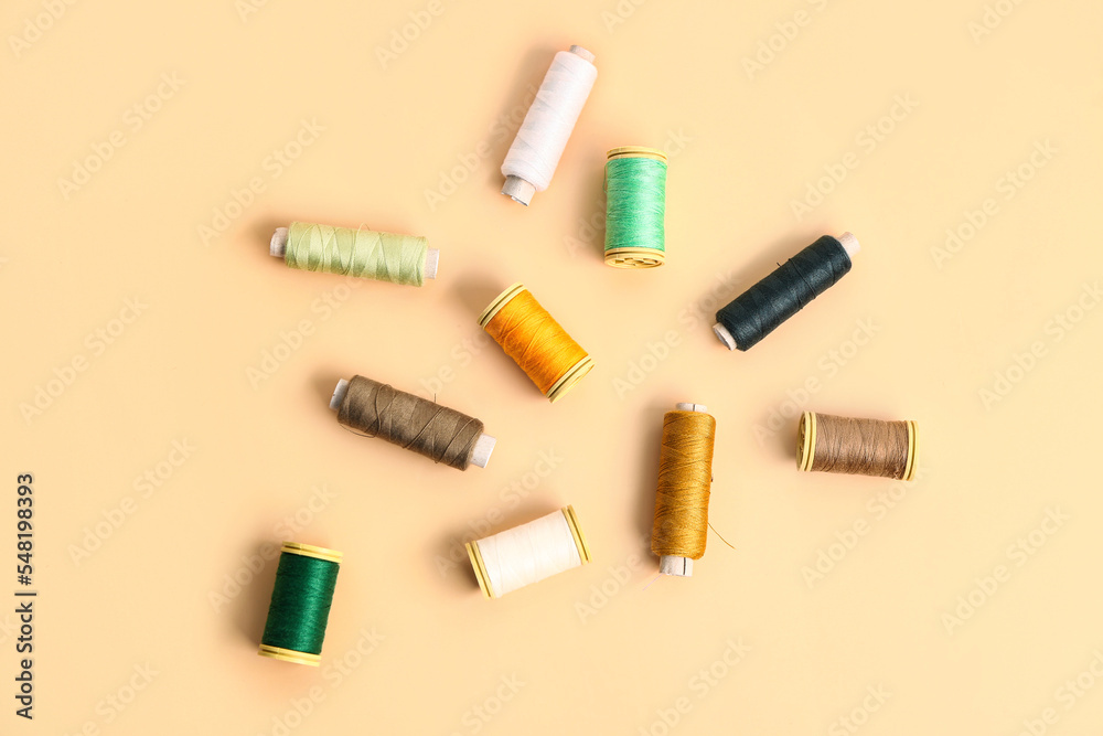 Set of different thread spools on color background Set of different thread spools on color background