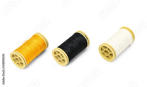 Different thread spools isolated on white background