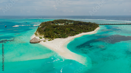 Resort island with bungalow in ocean. Maldivian resort. Paradise sand island in the ocean.