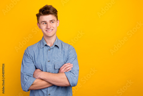 Photo of young business man employer friendly smiling arms crossed isolated shine color background © Tetiana