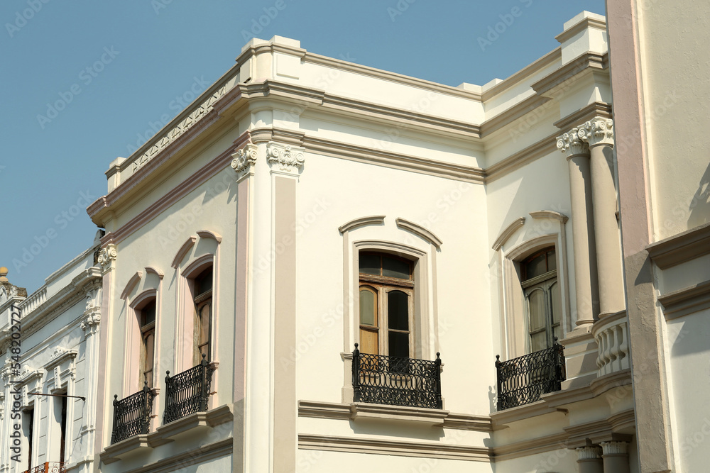 Exterior of beautiful building with windows and balconies