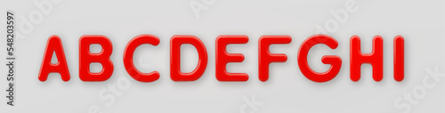 3D Red plastic uppercase letters A, B, C, D, E, F, G, H and I with a glossy surface on a gray background.