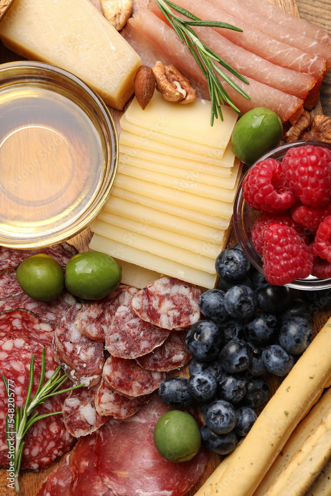 Snack set with delicious Parmesan cheese on plate, top view Snack set with delicious Parmesan cheese on plate, top view