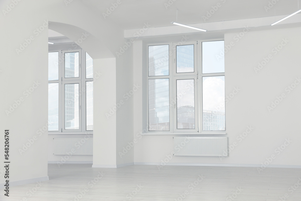 Modern office room with white walls and windows. Interior design Modern office room with white walls and windows. Interior design