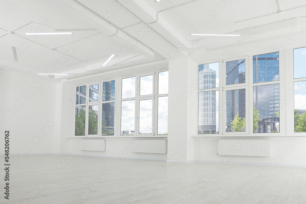 Fototapeta premium Modern office room with white walls and windows. Interior design