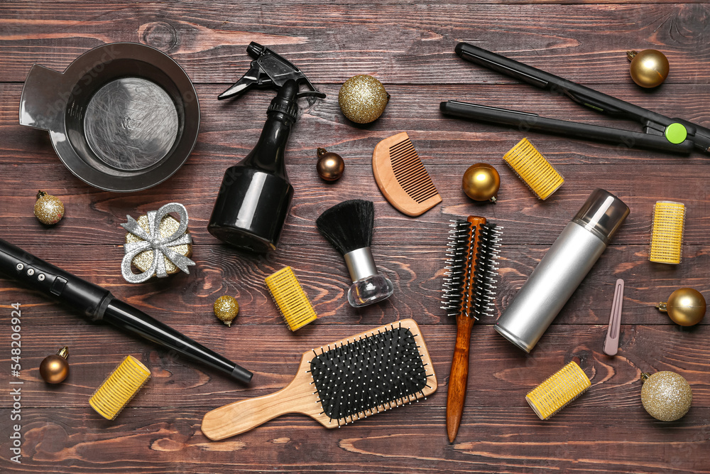 Hairdresser's tools with Christmas balls on wooden background Hairdresser's tools with Christmas balls on wooden background