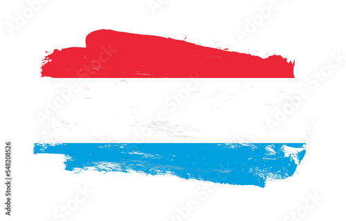 Obraz na plátne Stroke brush painted distressed flag of luxembourg on white background
