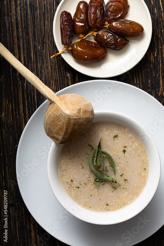 top view of a traditional Moroccan belboula,  Cream of Barley Soup with Dried date photo