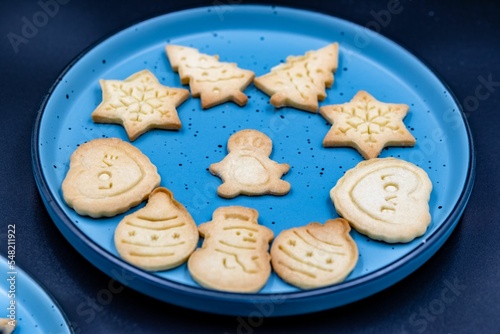 Tasty Christmas cookies in the blue plate