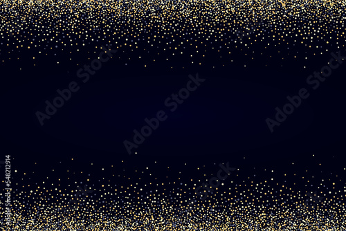 Black background with shiny gold dust.Festive background.