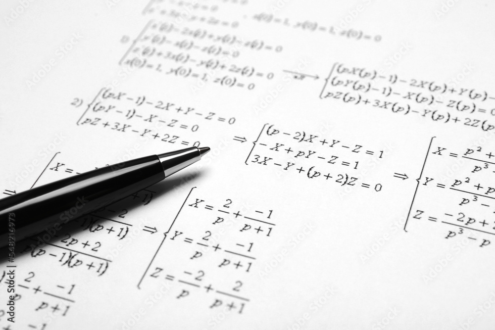 Sheet of paper with mathematical formulas and pen, closeup Sheet of paper with mathematical formulas and pen, closeup