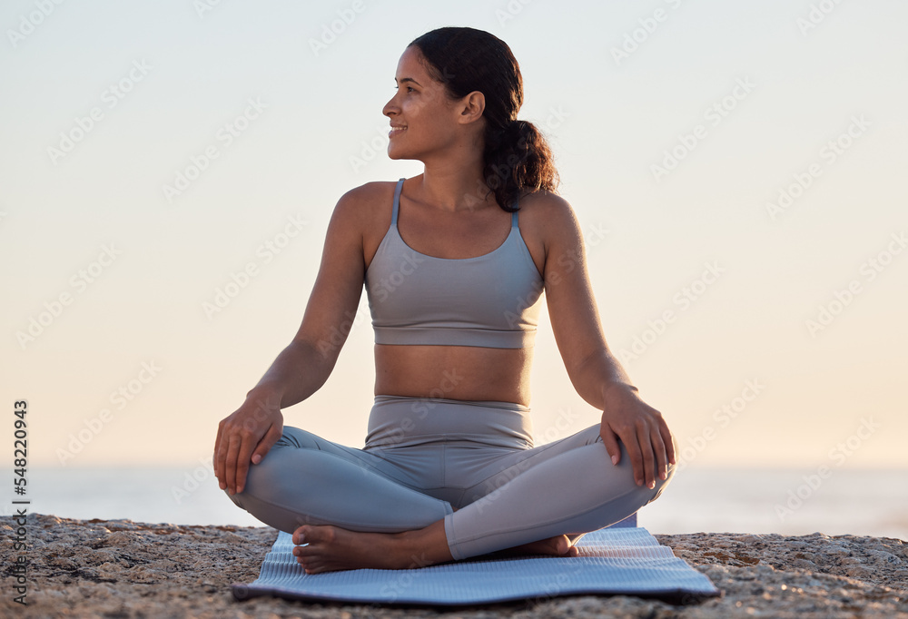 Yoga, meditation or zen exercise black woman relax on yoga mat at beach, sea or ocean for motivation, wellness or workout. Sunset, happy or girl portrait on sand for sport, chakra energy or training