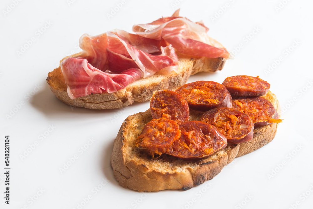 Slice of bread with chorizo and serrano ham Slice of bread with chorizo and serrano ham