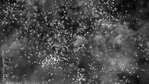 3D rendering of cluster of white particles flitting about on black background with bokeh