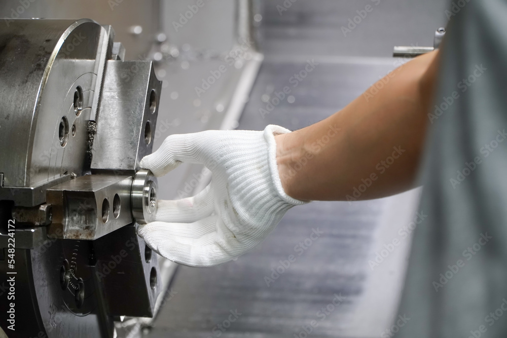 5-axis CNC lathe operator turning workpieces in collet chuck,Production of electric vehicle parts 5-axis CNC lathe operator turning workpieces in collet chuck,Production of electric vehicle parts