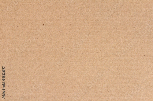 Cardboard sheet texture background, detail of recycle brown paper box pattern.