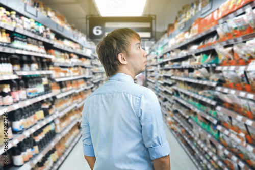 Asian business man walking shopping in a grocery store  © Rattanapon