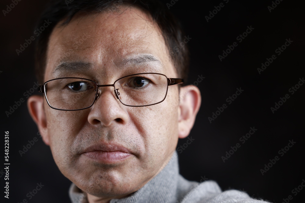 Middle-aged Japanese man in gray turtleneck wool sweater. Concept image of Warm Biz, stability in daily life, and sustainable living. Middle-aged Japanese man in gray turtleneck wool sweater. Concept image of Warm Biz, stability in daily life, and sustainable living.
