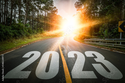 Empty asphalt road with New year 2023 concept. Direction to new year concept and sustainable development idea for goal and success. 