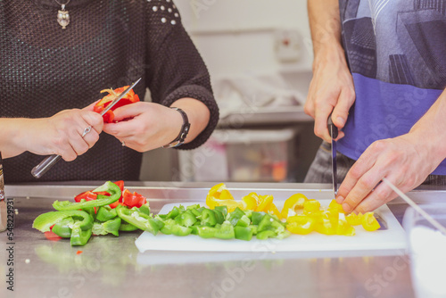 person cutting vegetables