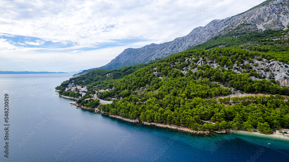 Igrane village on Makarska riviera church tower and waterfront view, Dalmatia region of Croatia Igrane village on Makarska riviera church tower and waterfront view, Dalmatia region of Croatia