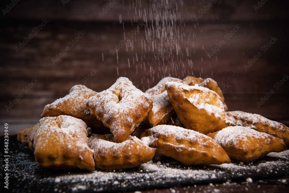 TRADITIONAL WONDERS OF SOUTH-WESTERN FRANCE, SPRINKLED WITH ICING SUGAR AND FLAVOURED WITH RUM AND ORANGE FLOWER WATER, High quality photo