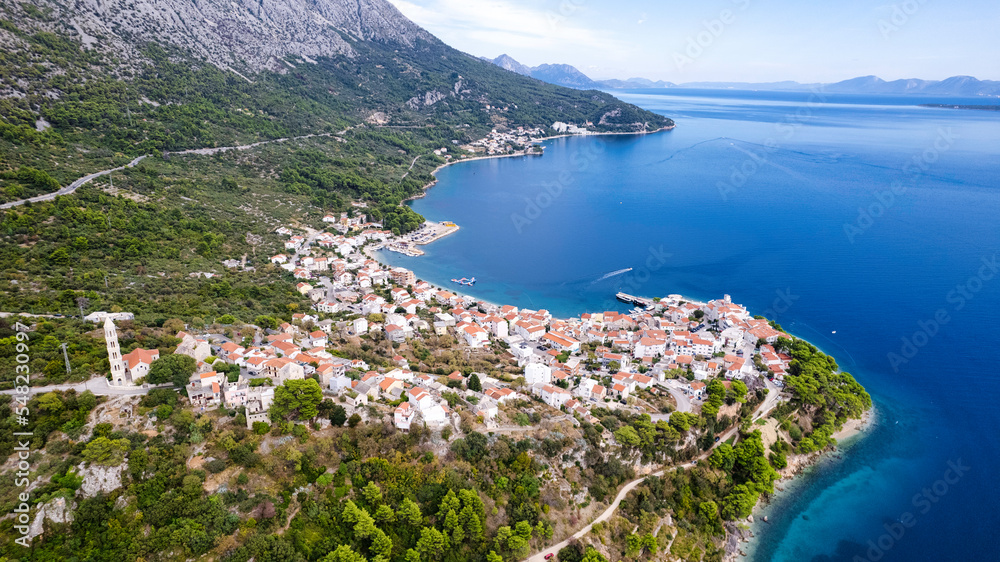 Igrane village on Makarska riviera church tower and waterfront view, Dalmatia region of Croatia