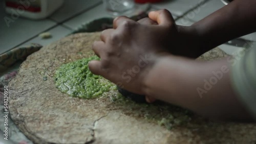 To pound the chilies with the salt, to inse, deseed, and thinly slice the chilli. To mash green peppers. To prepare the condiments for African cuisine, African spicy food, african cooking.