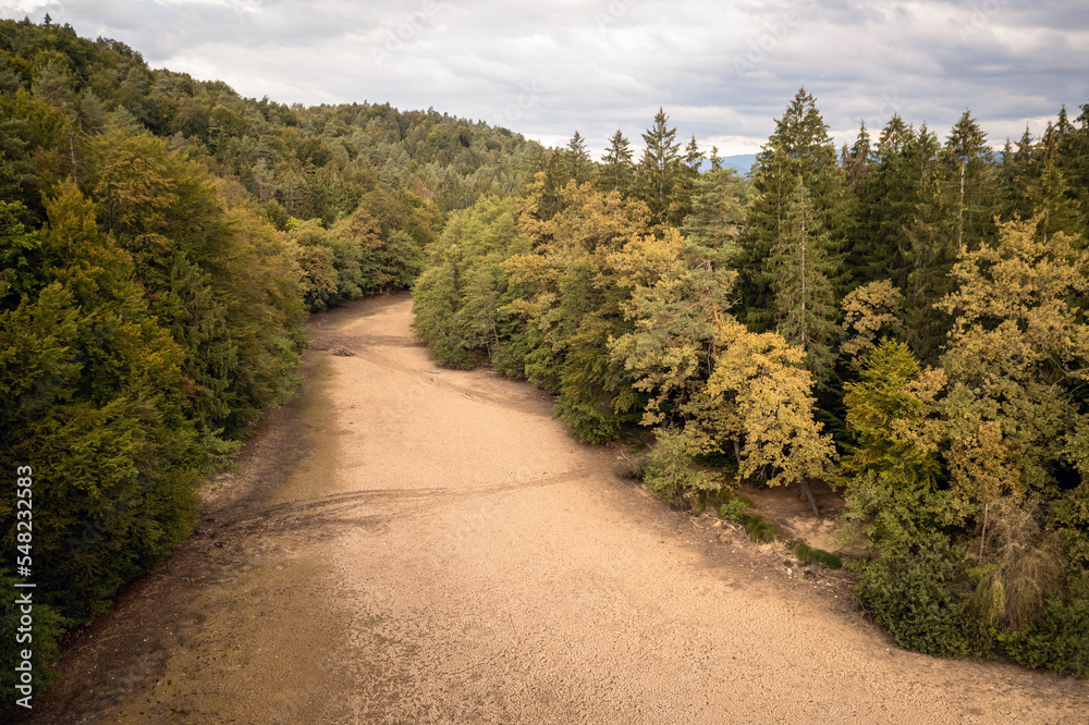 Landscape feature, dried channel river on the forest hill, after long summer drought season, drone shot.