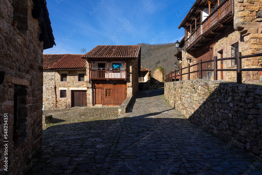 Beautiful village of Barcena Mayor with the traditional stone houses in the Cantabria mountains in a sunny day. Cantabria, Spain.