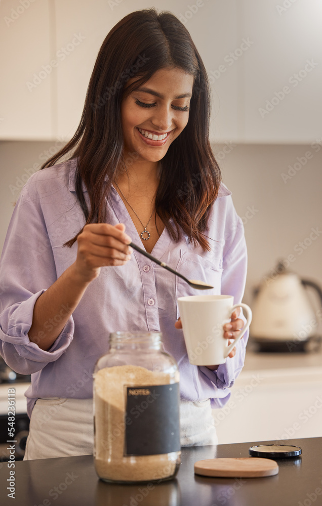 Woman, smile and morning making coffee in the kitchen for routine, start or daily preparation at home. Female smiling and adding sugar to mug for sweet warm beverage drink or caffeine at the house Woman, smile and morning making coffee in the kitchen for routine, start or daily preparation at home. Female smiling and adding sugar to mug for sweet warm beverage drink or caffeine at the house