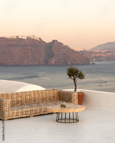 Dreamy minimalist terrace and bench in Santorini island in Greece overlooking the Aegean sea