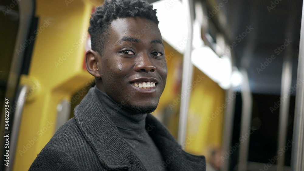 Portrait black man standing at metro subway commuting Portrait black man standing at metro subway commuting