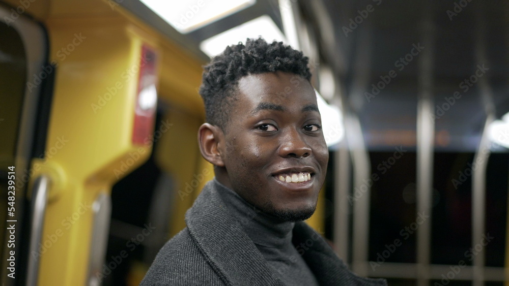 Portrait black man standing at metro subway commuting Portrait black man standing at metro subway commuting